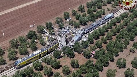 This aerial handout photo shows what is left of two commuters trains after their head-on collision in the southern region of Puglia, Tuesday, July 12, 2016. At least 12 people died and several others are reported injured.