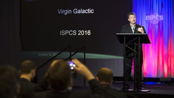 Mike Moses, SVP Operations SPA, President of Virgin Galactic, speaks on the topic “We Open Space to Change the World for Good” on Thursday, October 13, 2016, during the International Symposium for Personal and Commercial Spaceflight (ISPCS) conference.