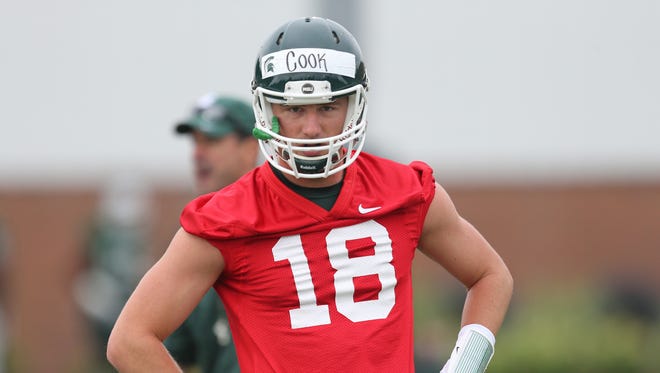 Michigan State quarterback Connor Cook goes through drills during practice Aug. 8, 2015, at the Duffy Daugherty football building in East Lansing.