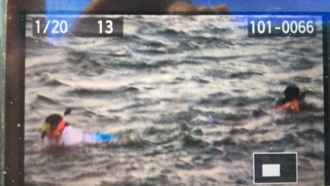A bystander captured this image of the two snorkelers who were reportedly swept out to sea early Saturday morning near the North Jetty in Fort Pierce.