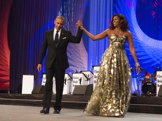 President Obama and Michelle arrive on stage during