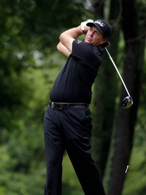 Phil Mickelson watches his tee shot on the second hole during the second round of the PGA Championship golf tournament at Valhalla Golf Club on Friday, Aug. 8, 2014, in Louisville, Ky. (AP Photo/Jeff Roberson)