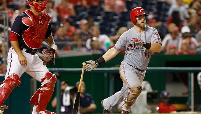 Cincinnati Reds catcher Tucker Barnhart (16) hits a double against the Washington Nationals in the 10th inning at Nationals Park. The Nationals won 3-2.