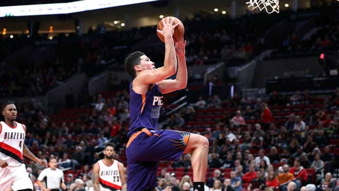 Oct 7, 2016: Phoenix Suns guard Devin Booker (1) jumps towards the basket against the Portland Trail Blazers in t he first half at Moda Center at the Rose Quarter.