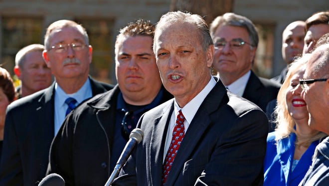 State senate president, Andy Biggs speaks at a press conference in support of a bill overhauling the Public Safety Personnel Retirement System in Phoenix at the state Capitol Rose Garden on February 2, 2016. 