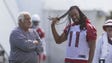 Cardinals Larry Fitzgerald talks with Assistant head