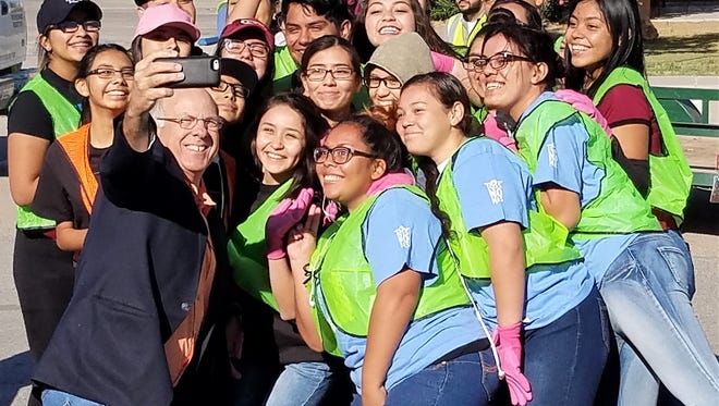 U.S. Rep. Steve Pearce takes a selfie with other volunteers helping in the Sunland Park Earth Day community clean up