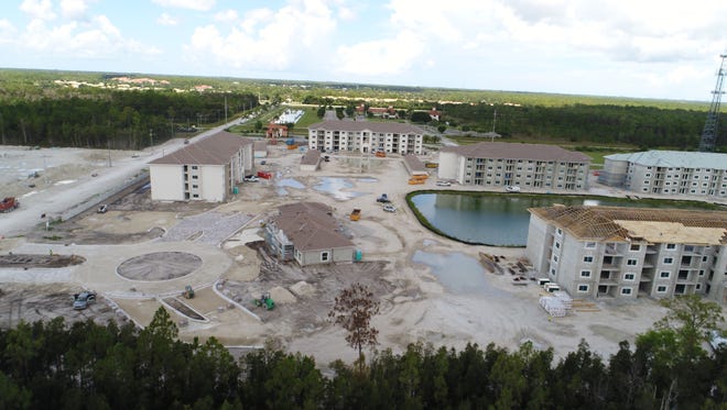 An aerial of Milano Lakes apartments shows construction moving ahead toward an opening in early 2018.