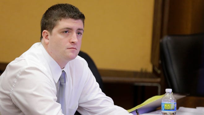 Cleveland police Officer Michael Brelo listens to testimony during his trial in Cleveland.