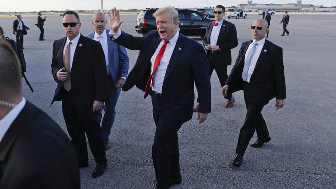 In this April 18, 2019, file photo, President Donald Trump walks across the tarmac to greet supporters during his arrival at Palm Beach International Airport. As the Russia investigation threatened to shadow Donald Trump’s presidency, he became increasingly concerned he would be seen as a cheater and a fraud.