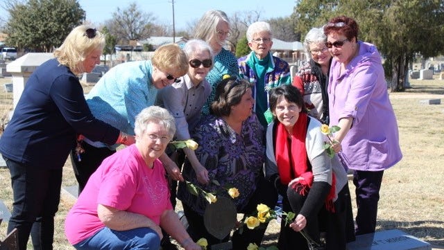 Members of the John Davis Chapter place yellow roses on the grave of Mary Houston Morrow, daughter of Sam Houston, to commemorate her birthday and Texas Independence Day. Morrow is buried in the Texas Municipal Cemetery in Abilene and was the city’s first postmistress.