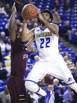 Cazmon Hayes is fouled as he goes to the basket against Charleston's Payton Hulsey in the second half of the Blue Hens' 62-59 win at the Carpenter Center this season.