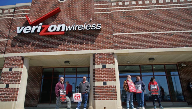 Verizon workers strike outside the store on Concord Pike on April 12. Nearly 40,000 employees of Verizon went on strike last month seeking improved benefits and work conditions.
