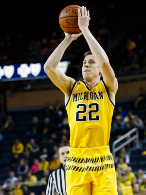 Feb 24, 2016; Ann Arbor, MI, USA; Michigan Wolverines guard Duncan Robinson (22) shoots the ball in the first half against the Northwestern Wildcats at Crisler Center.