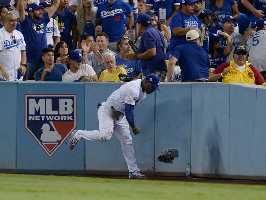 Game 2 at Dodger Stadium: Yasiel Puig throws his glove
