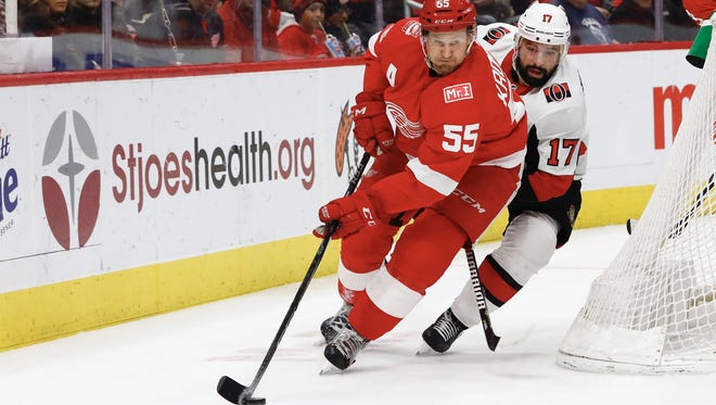 Niklas Kronwall skates with the puck chased by Senators center Nate Thompson in the first period at Little Caesars Arena on Wednesday.