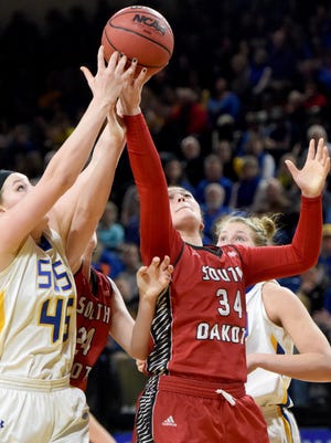 SDSU's Ellie Thompson and USD's Kate Liveringhouse go up for a rebound on Saturday at Frost Arena in Brookings.