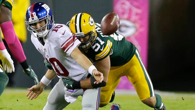 Green Bay Packers outside linebacker Kyler Fackrell sacks New York Giants quarterback Eli Manning.
