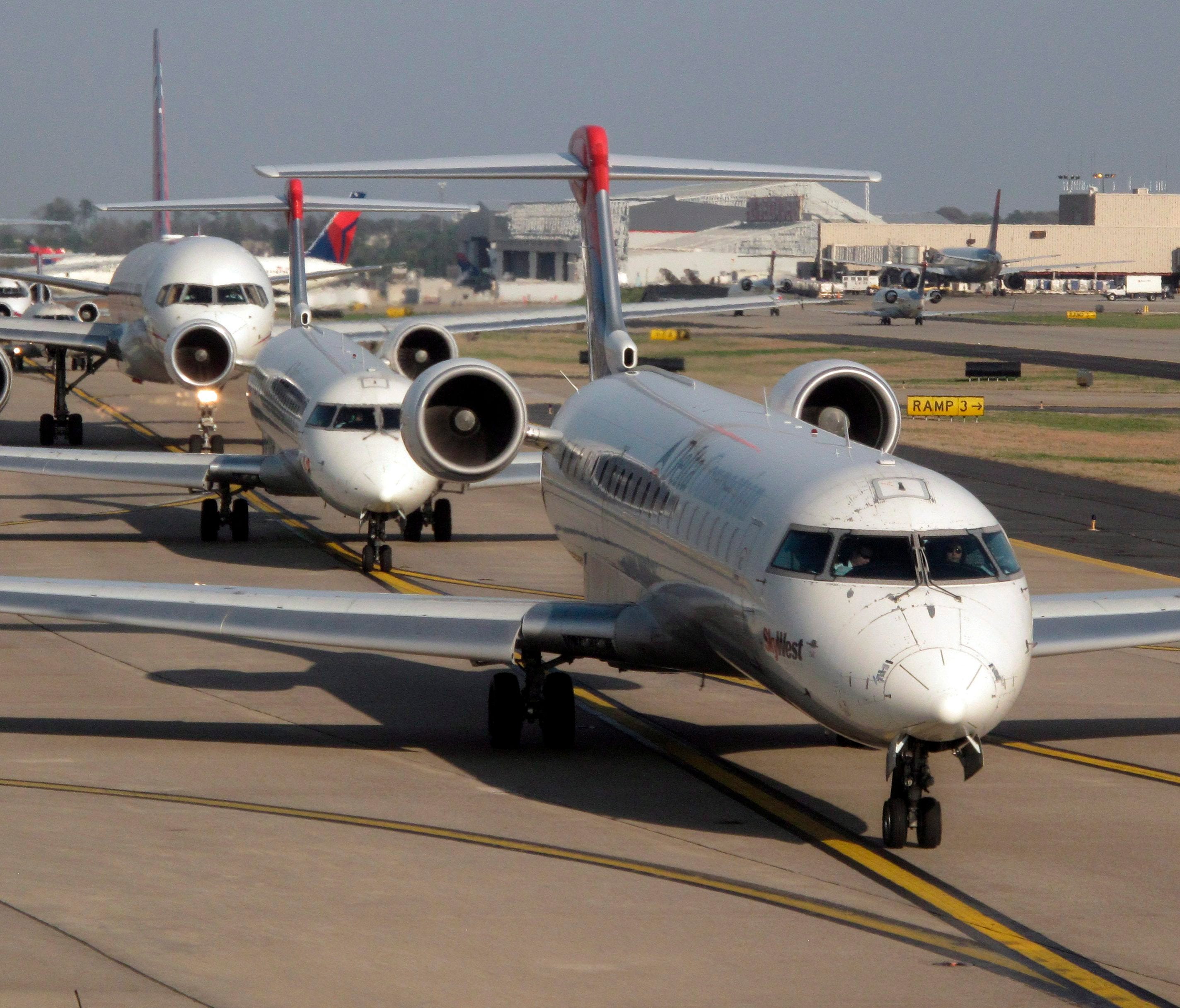 Delta planes line up for takeoff at Atlanta Hartsfield-Jackson International Airport.