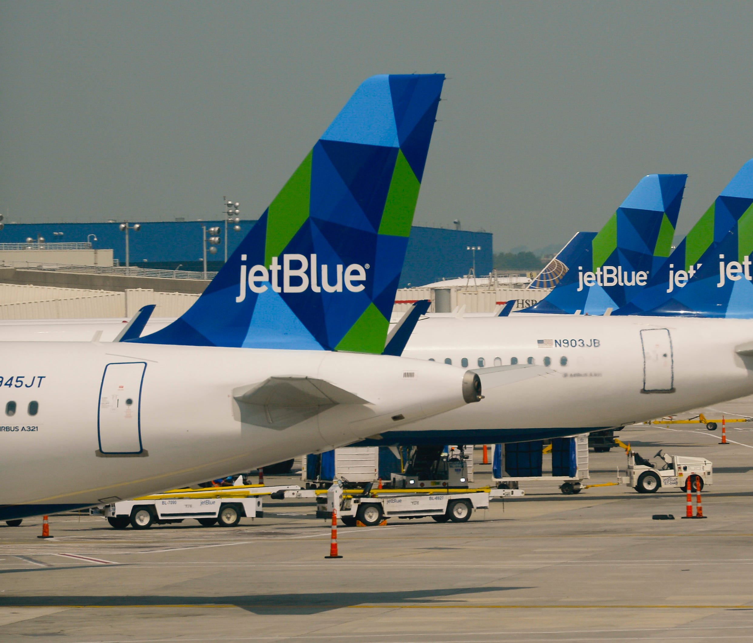 This file photo from June 2015 shows Jet Blue planes at New York's JFK Airport.