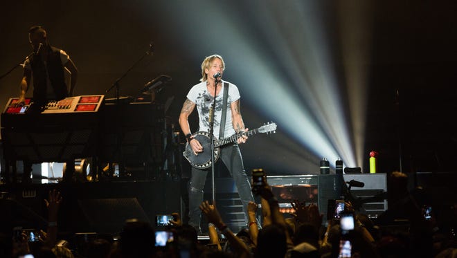 Keith Urban and his band entertained a large crowd of fans at the Pan American Center at New Mexico State University, Tuesday, October 18, 2016.