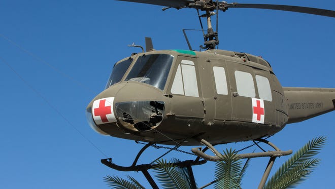 The Bell UH-1 Iroquois helicopter better known as a Huey, that floats above the Vietnam Veterans Memorial at Veterans Park, had a nose plate broken, possibly vandalized. Thursday May 17, 2018.