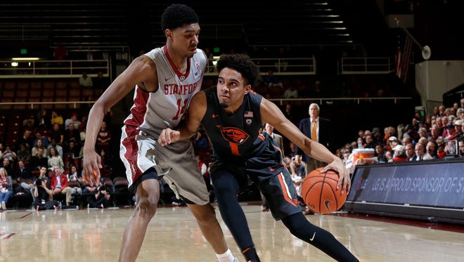 Oregon State guard Stephen Thompson Jr., right, is defended by Stanford forward Marcus Sheffield during the first half of an NCAA college basketball game Wednesday, Feb. 22, 2017, in Stanford, Calif.