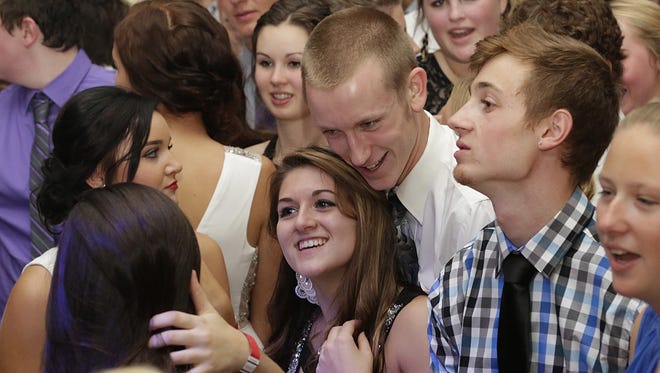 Students attend the Fond du Lac homecoming dance last September at the Fond du Lac High School.