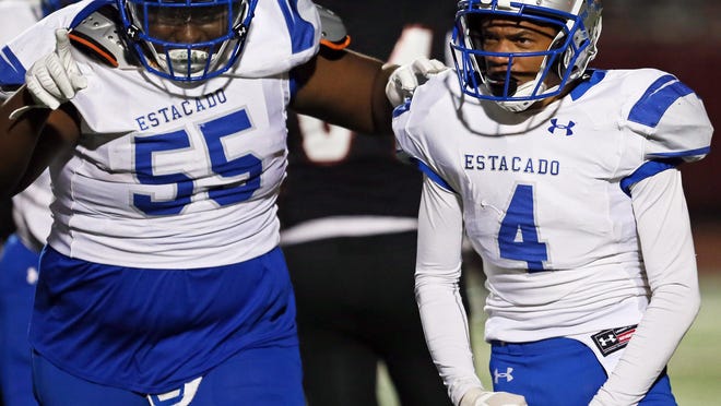 Estacado free safety Anthony Hawkins (4) celebrates an interception with defensive lineman Papa Bluitt during a District 3-4A, Division II game against Levelland on Nov. 8, 2019, at Lobo Stadium in Levelland. After team leaders graduated like Bluitt, who is now playing for Tarleton State University, and Sederick Colbert, who signed with West Texas A&M University, Hawkins stepped up and has taken on a leadership role.