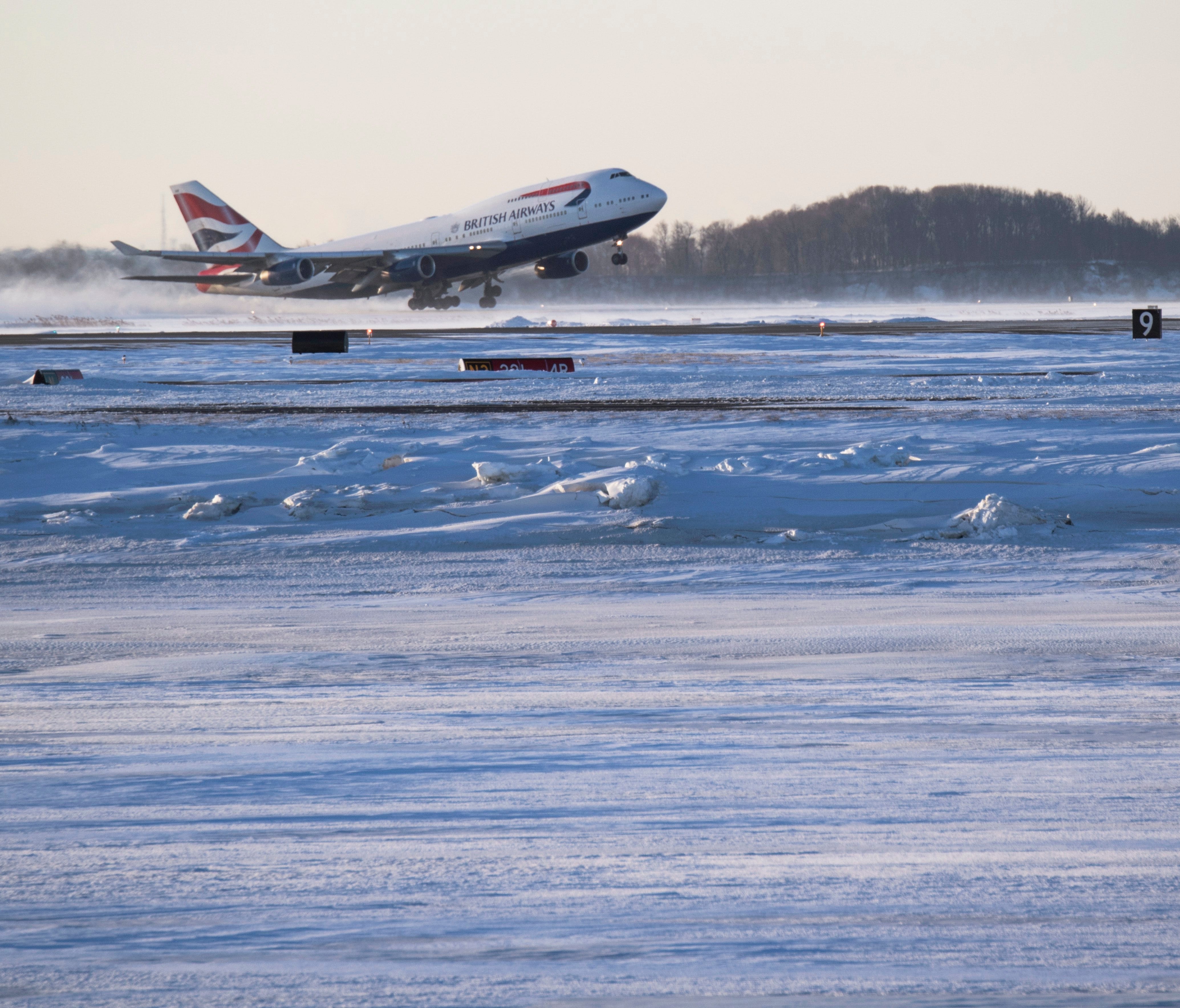 A British Airways 747 departs from snowy Boston en route to London Heathrow on Jan. 6, 2018.