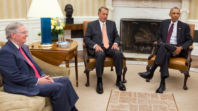 Then-Senate Minority Leader Mitch McConnell and House Speaker John Boehner, both Republicans, met with President Barack Obama in the Oval Office in September.