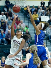Pittsford Mendon's Lexi Green sends the ball to the