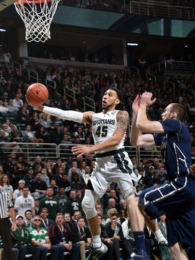 Denzel Valentine slashes to the basket in the first
