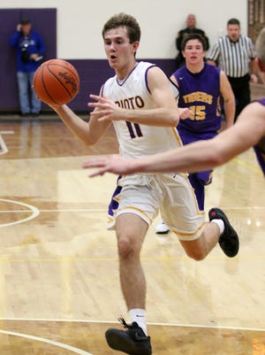 Unioto's Brandon Kennedy looks for an open teammate during an earlier season contest against McClain. Kennedy is the area's leader in three-point field goal percentage.