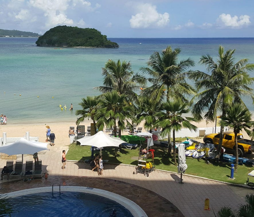 Tourists enjoy the beach in Guam's capital of Hagatna on July 14, 2017.