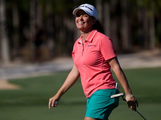 Naples local and LPGA tour pro Mo Martin smiles after sinking a putt on the eighth hole during the first round of the CME Group Tour Championship at Tiburon Golf Club Thursday, Nov. 16, 2017 in Naples. 