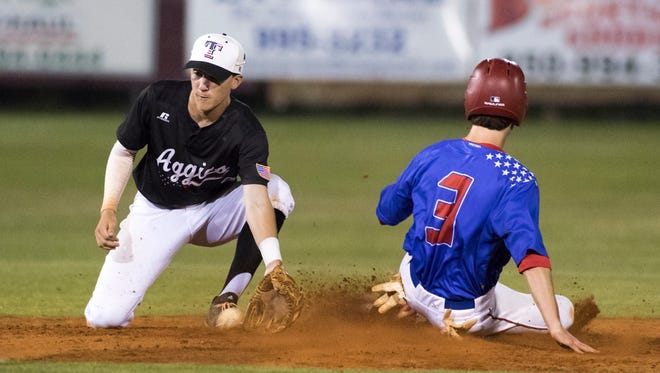 JC Peacher (3) safely slides into second base as Mason Land (9) can't hang onto the throw during the District 1-7A baseball championship game between Pace and Tate high schools at Pace High School on Thursday, May 3, 2018.