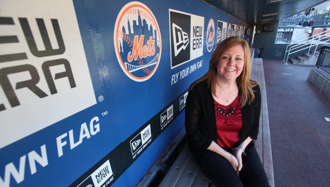 In this 2012 photo, Shannon Dalton Forde of Little Ferry sits in the dugout at Citi Field.