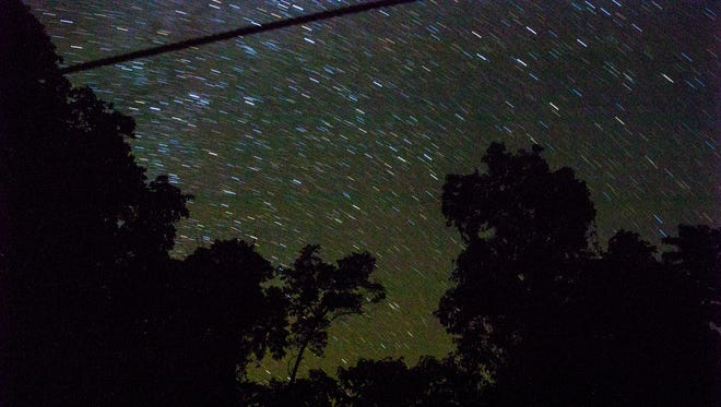 Stars travel above the Goualougo Triangle basecamp.