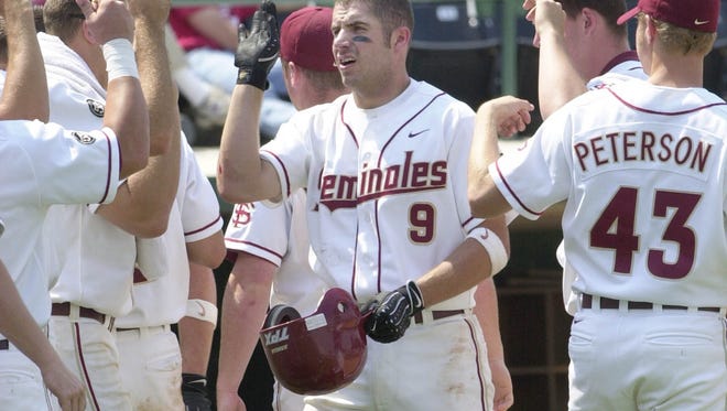 Florida State's Karl Jernigan (9) celebrates after hitting a home run against North Carolina State during the 2001 ACC Tournament. Jernigan, who played high school baseball at Milton, is now the head baseball coach at Tate.