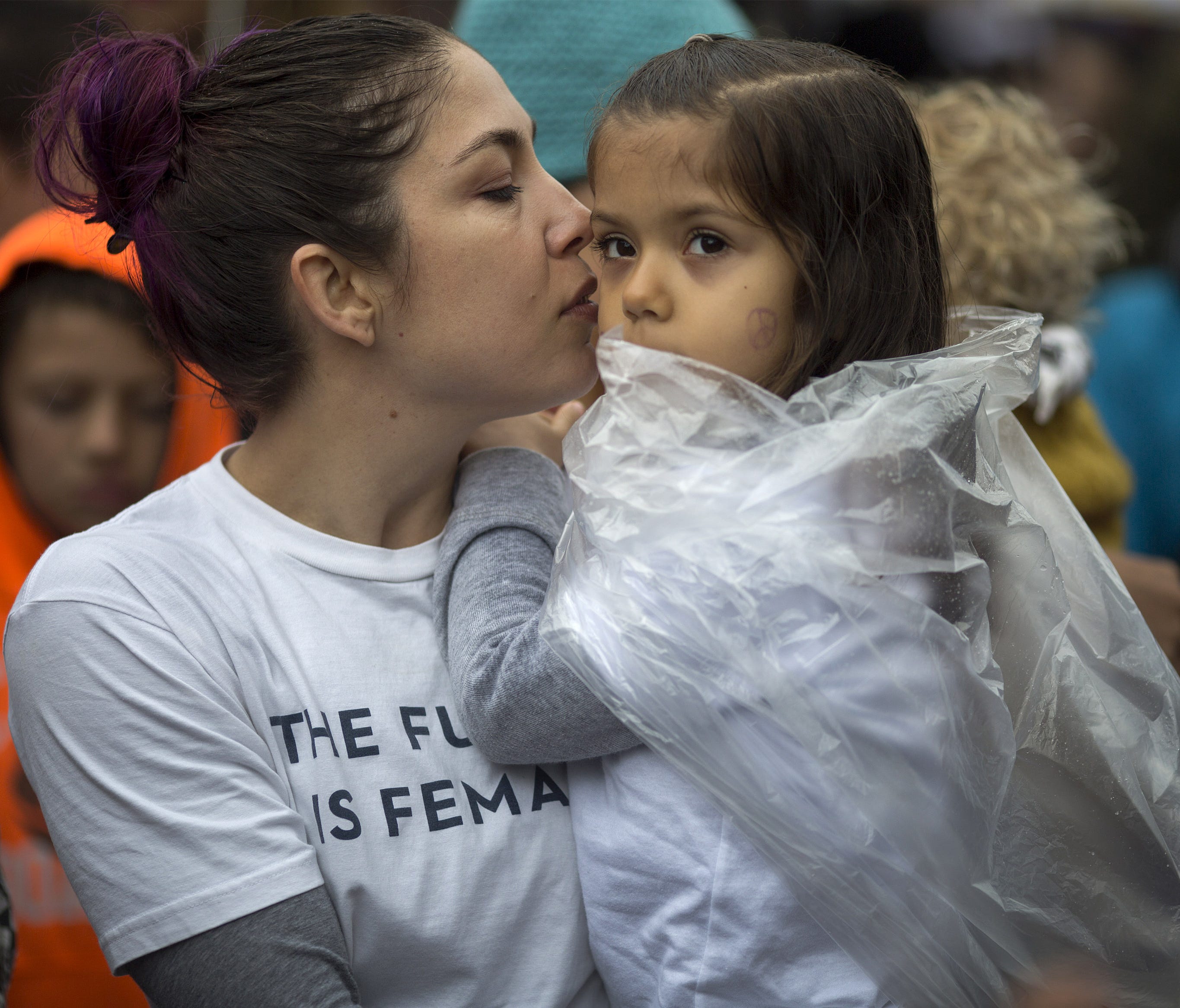 A woman and child attend the International Women's Day March and Rally on March 5, 2017 in Los Angeles.