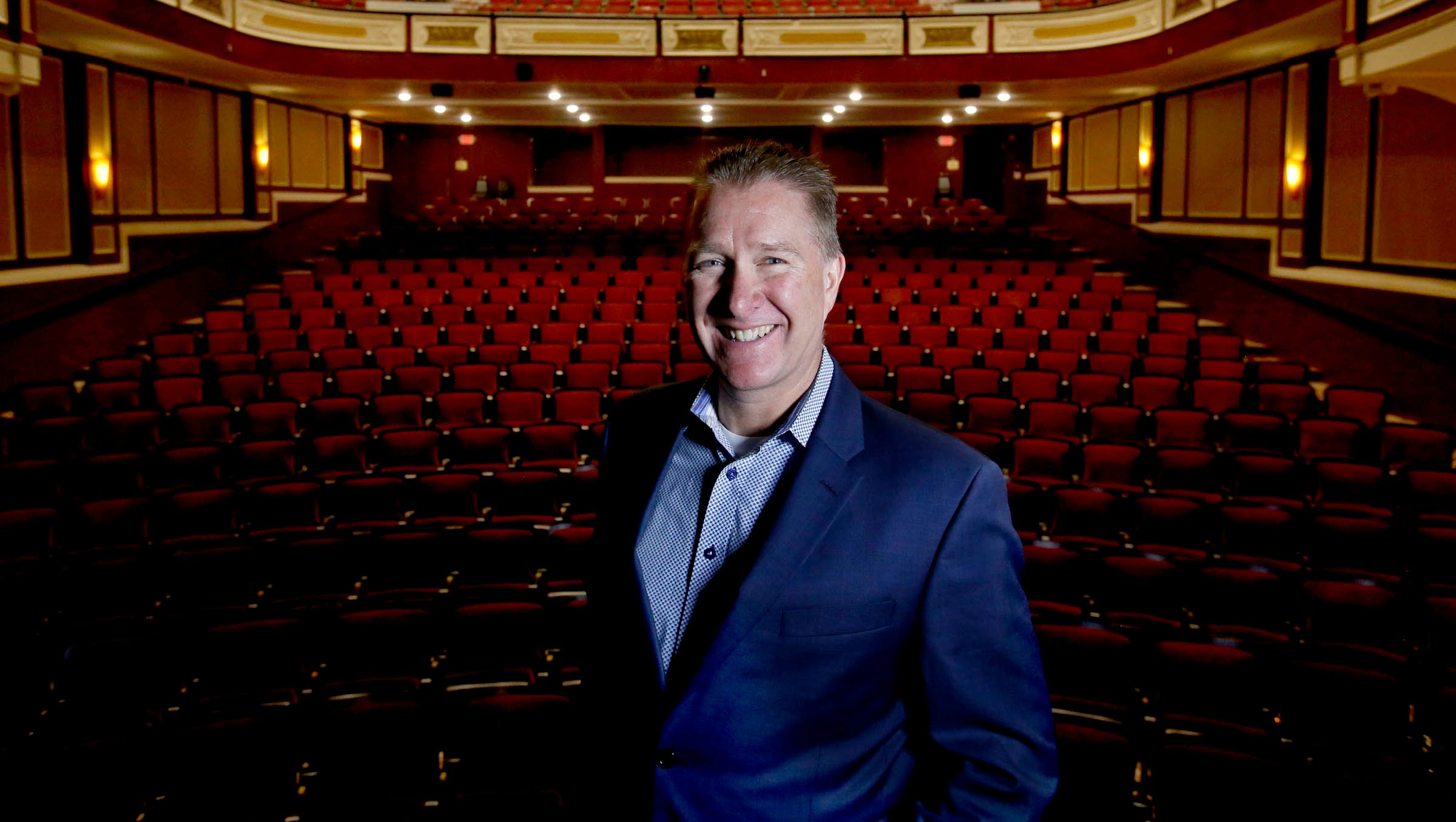 Kyle Westberg, co-owner of the Flagstar Strand Theatre for the Performing Arts in downtown Pontiac, on stage in the theater on Friday, May 4, 2018.