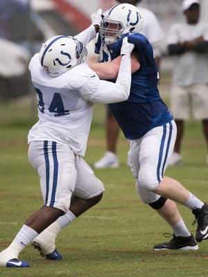 Zach Kerr (left), and Jack Mewhort, work against each other during daily Colts training Camp, at Anderson University, Anderson, Friday, July 29, 2016. The day's practice was shortened by a storm that rolled through.