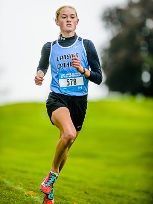 Lansing Catholic senior Olivia Theis is considered one of the nation's best girls high school distance runners by DyeStat and MileSplit.