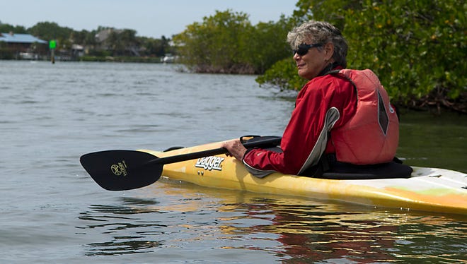 Former Martin County Commissioner Maggy Hurchalla kayaks on the Indian River Lagoon south of the St. Lucie Inlet on March 14, 2013.