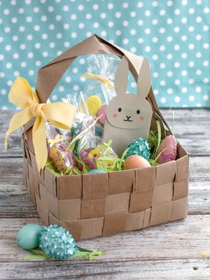 This undated photo shows an upcycled DIY Easter basket made from four brown paper grocery bags, cut into strips and woven together. Fresh takes on Easter baskets for kids include a heavy dose of do-it-yourself ingenuity.