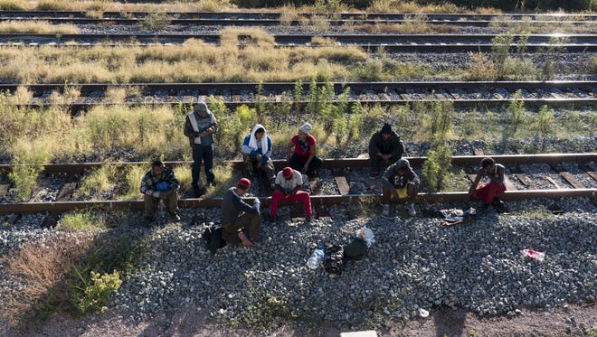 Hondurans and other Central Americans take a freight train known as "The Beast" through Mexico to reach the U.S.-Mexico border in late October 2016.
