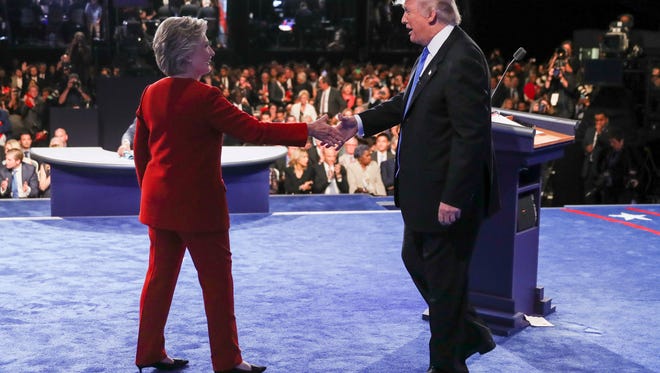 Democratic presidential nominee Hillary Clinton shakes hands with Republican presidential nominee Donald Trump after the presidential debate at Hofstra University in Hempstead, N.Y., Monday, Sept. 26, 2016.