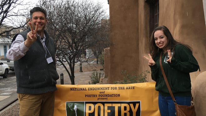 Oñate High School senior Destiny Gonzales (right) celebrates her second place win at the 16th annual New Mexico Poetry Out Loud State Finals with her coach and adviser OHS English Teacher Tim Staley (left)