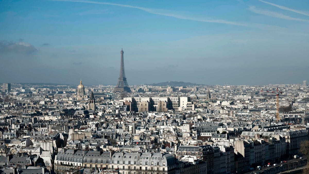 The Eiffel Tower and the dome of Les Invalides, are seen along the skyline of Paris.